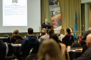 Don Morris, executive director of the Oklahoma Office of Workforce Development, talks to the crowd gathered at the Northeastern State University Broken Arrow campus for the 2nd Annual Supply Chain and Logistics Conference on March 2, 2023.